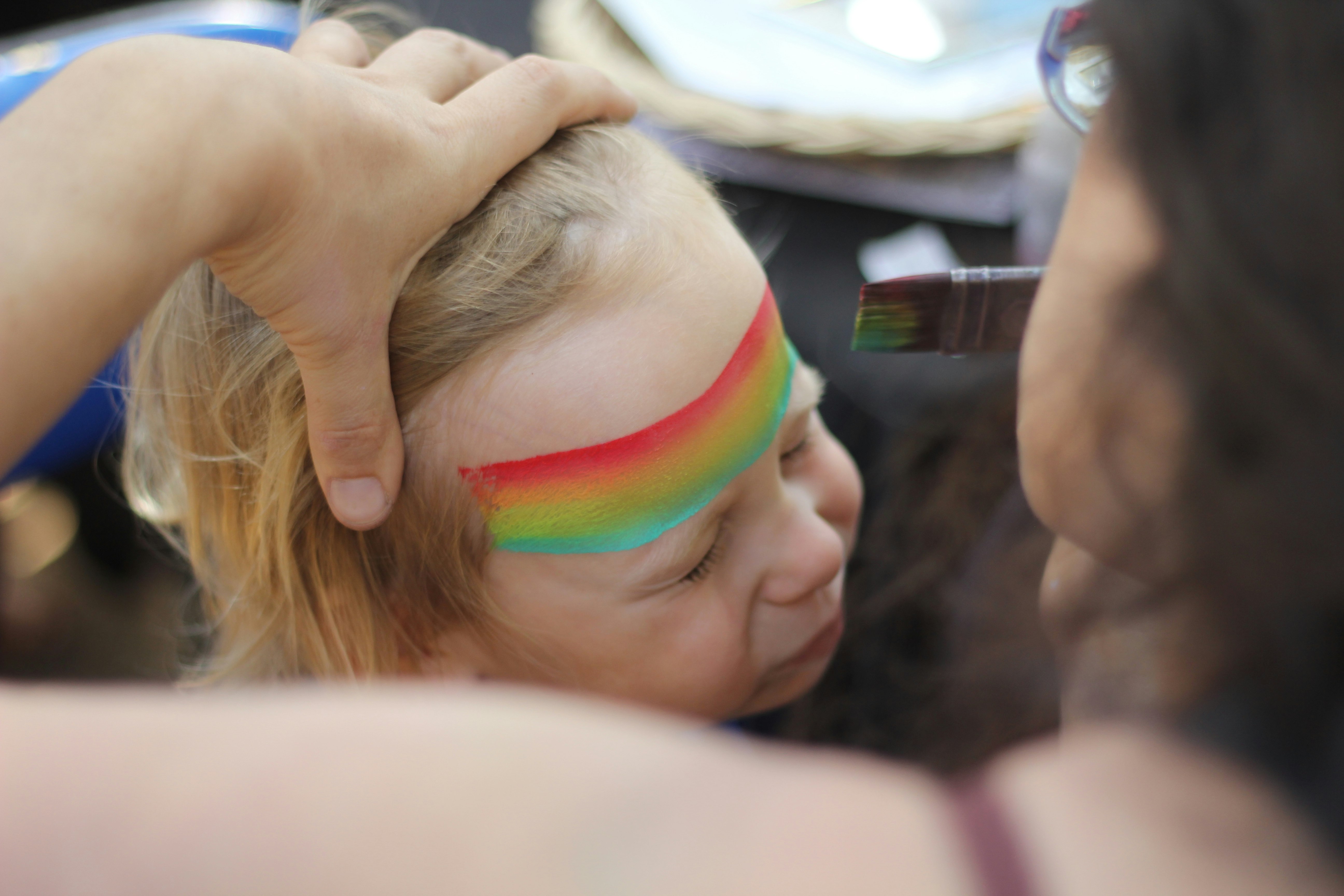 woman stroking child's hair